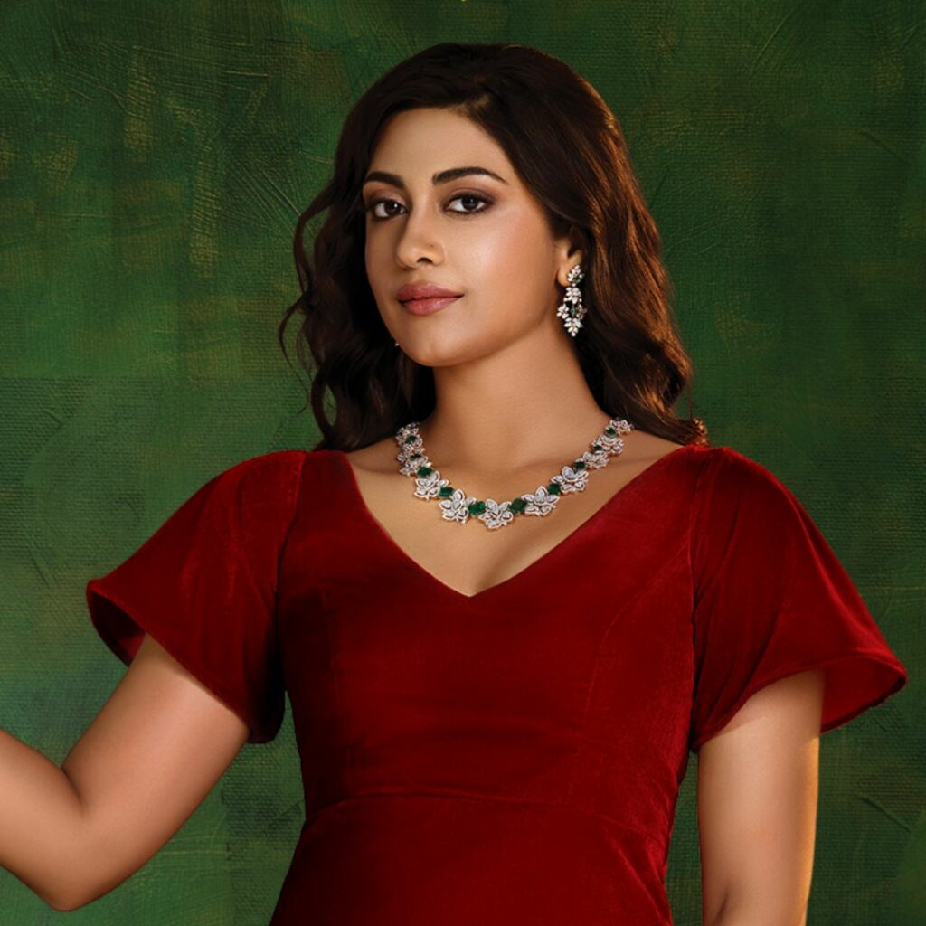 Diwali Jewellery Offers On Diamond, Platinum and Solitaire 3 Diamond Necklace with Leaf-Floral Motif and Emerald Accents